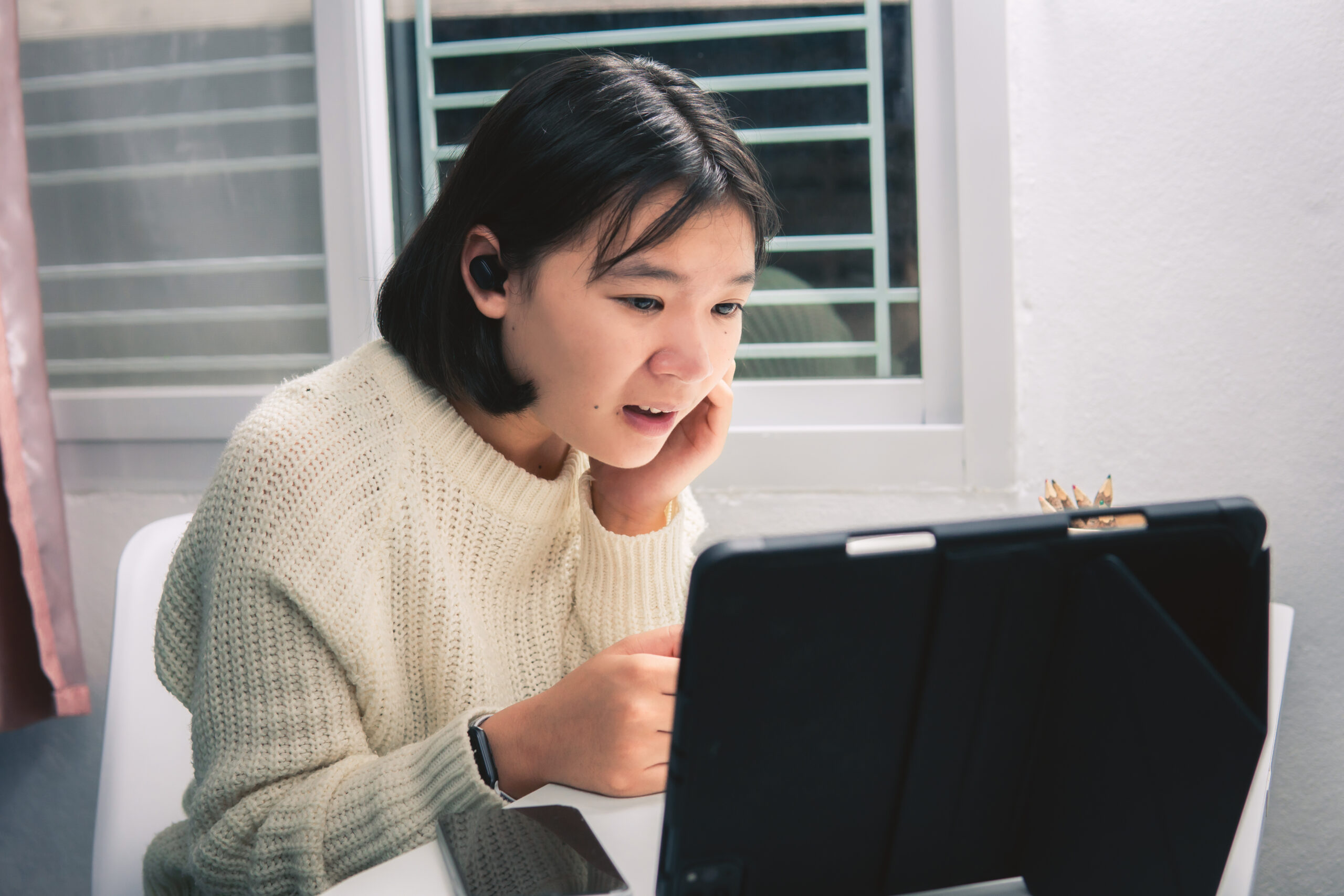 Home school Asian student learning online from lockdown and covid 19 epidemic.